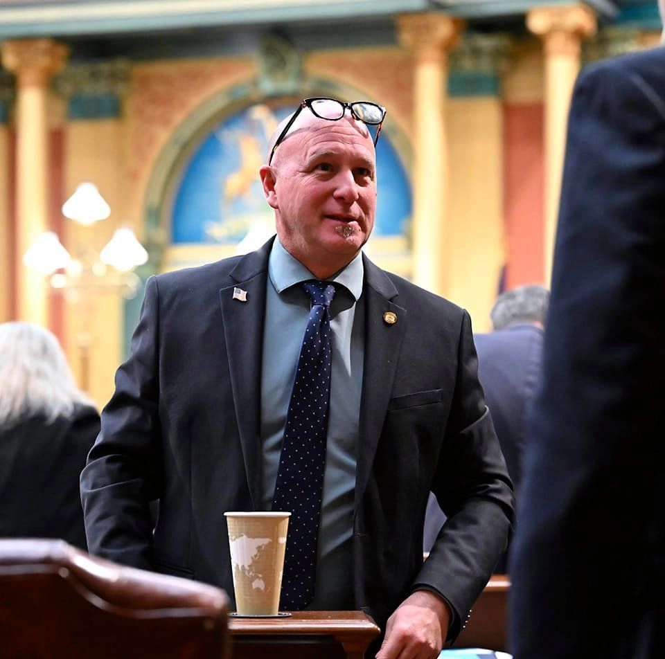 State Rep. Jay DeBoyer wearing a dark suit and tie