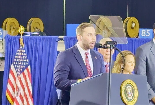 Michael Bouchard speaking on stage at the July 27 Trump event in Milford