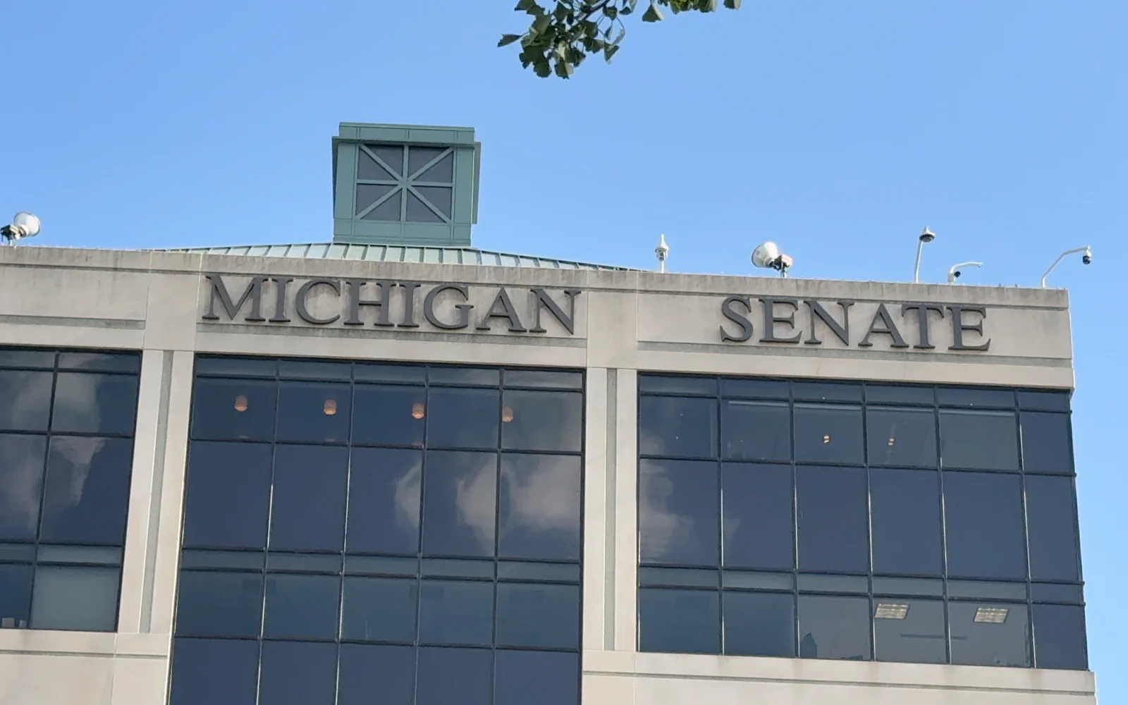 Michigan Senate lettering across the office building facade in Lansing.