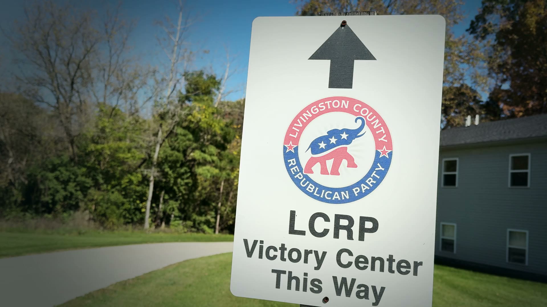 A Livingston County Republican Party sign beside an autumn landscape